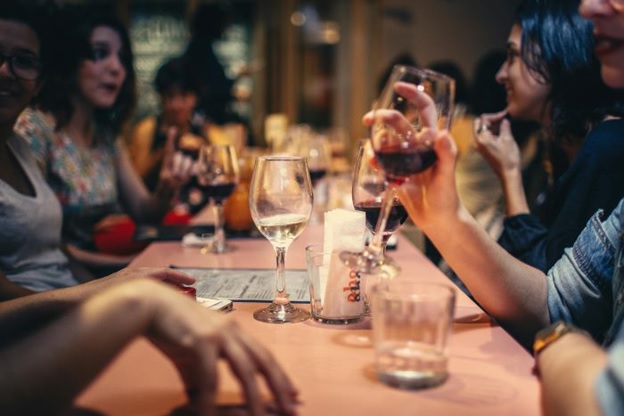 People enjoying wine tastings and live music at an Adelaide wine festival.