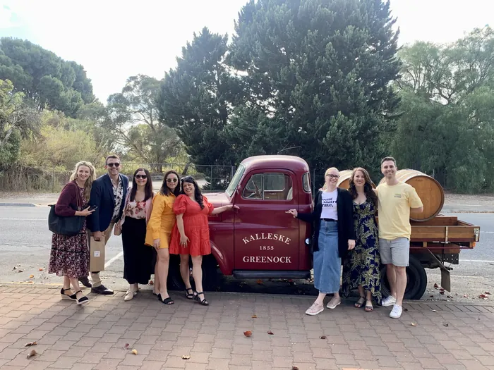 Tour guests posing beside the vintage Kalleske ute at Greenock in the Barossa Valley